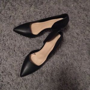 Plain black heels with pointed toe